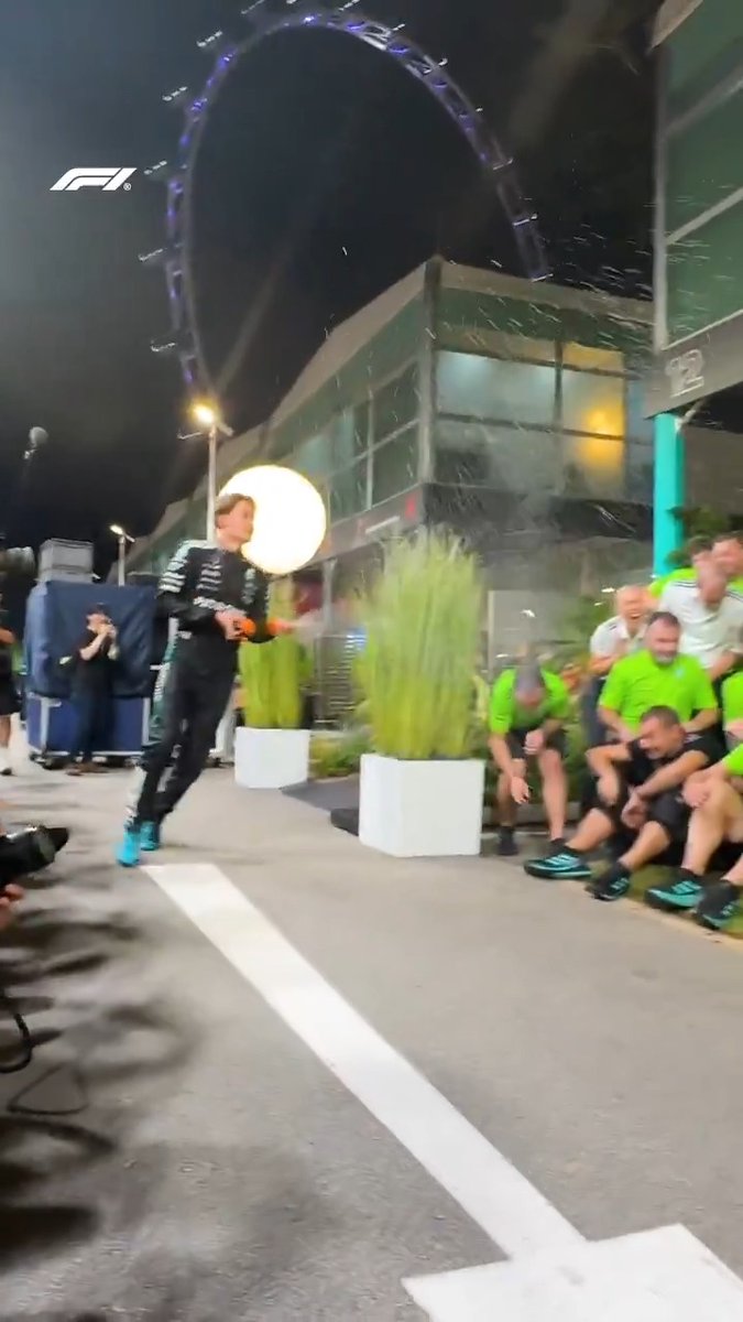 George gives his team a surprise early champagne shower at the team photo 😅🍾 #F1 #SingaporeGP