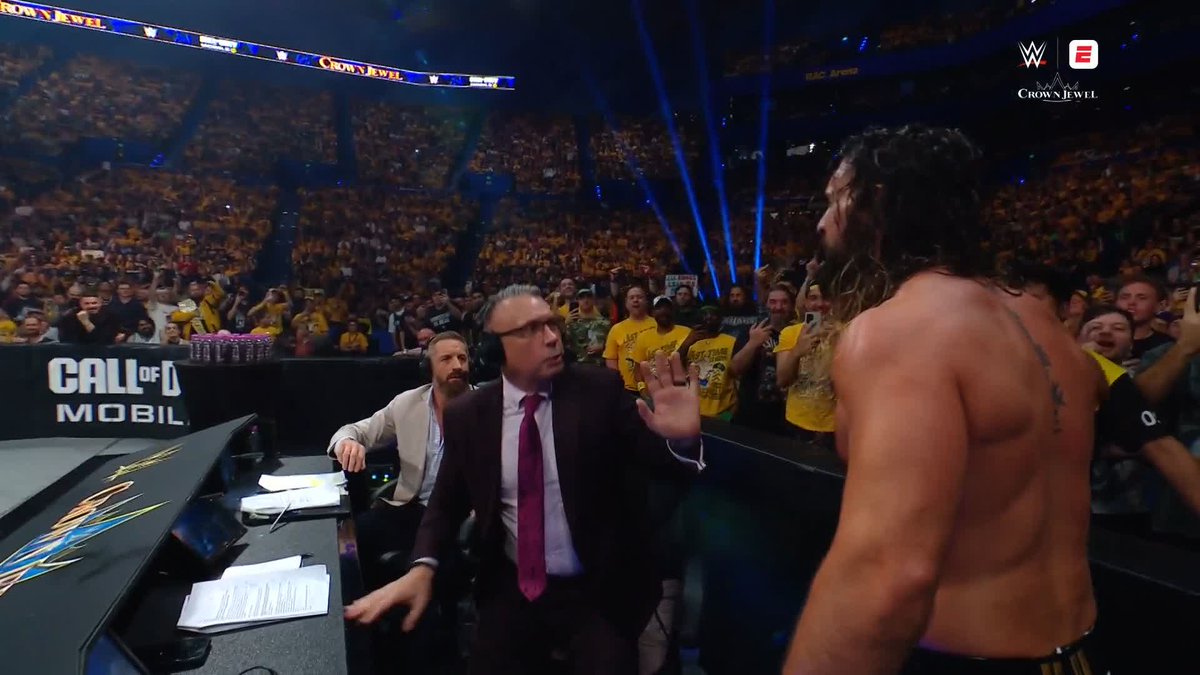 Don't put your hands on Michael Cole, Seth Rollins! 😡