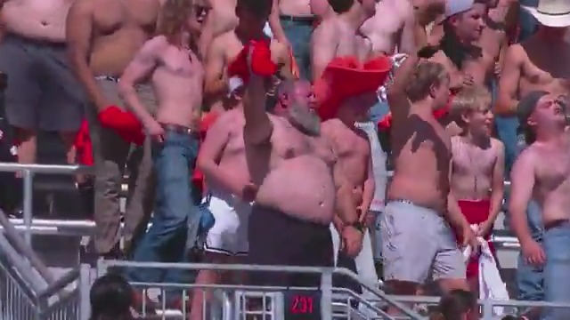 This entire Oklahoma State student section has their shirt off 😭