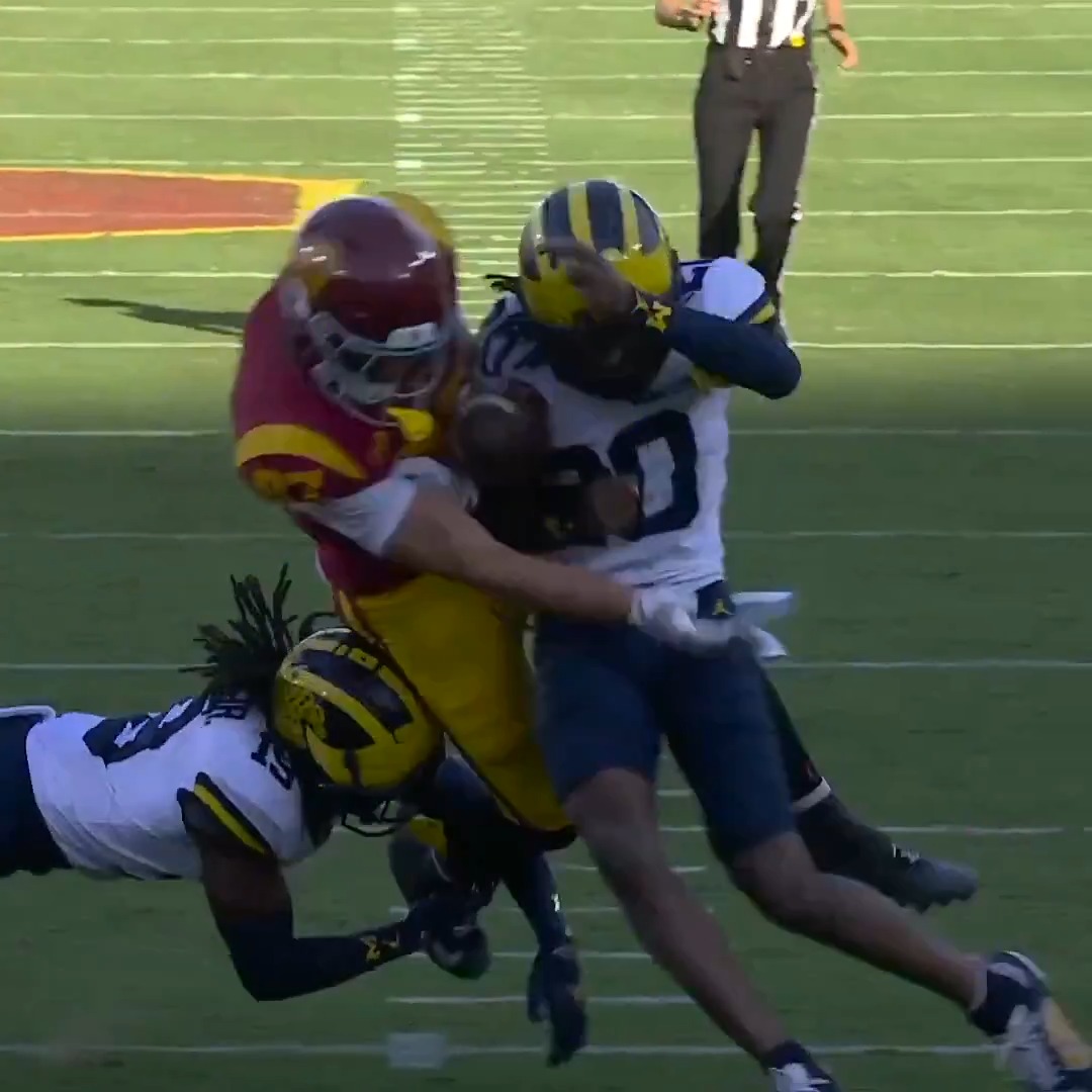 WHAT. A. HIT. Jyaire Hill knocks it out and Michigan recovers! 👀