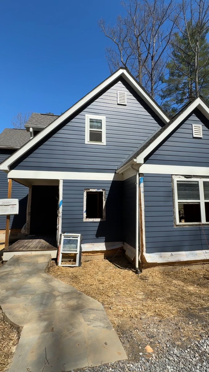 At Paula’s in East Asheville, water damage meant taking down the siding halfway up the house. Now it’s getting replaced with new siding as the rebuild moves forward. #TOHAsheville