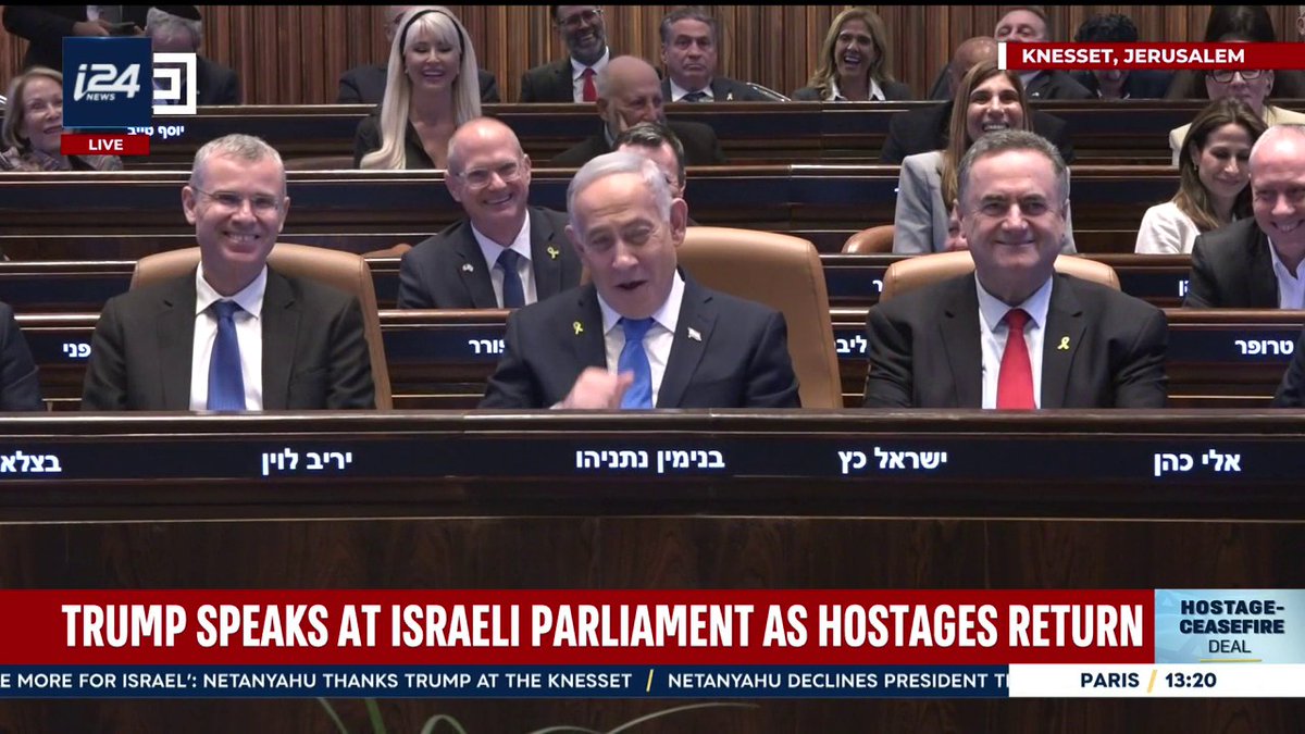 Left-wing Hadash party leader Ayman Odeh and party member Ofer Cassif interrupt President Trump's speech, yelling and holding a sign that says "Recognize a Palestinian state," and are forcefully removed from the Knesset by security