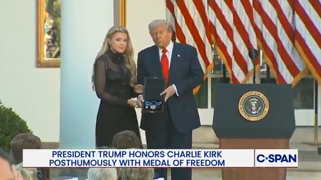 Erika Kirk, the widow of Charlie Kirk, accepts the Presidential Medal of Freedom on behalf of her late husband.