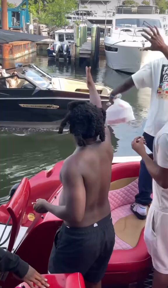 Kodak Black and his partners spotted networking on a boat in Florida. 🌴🚤
