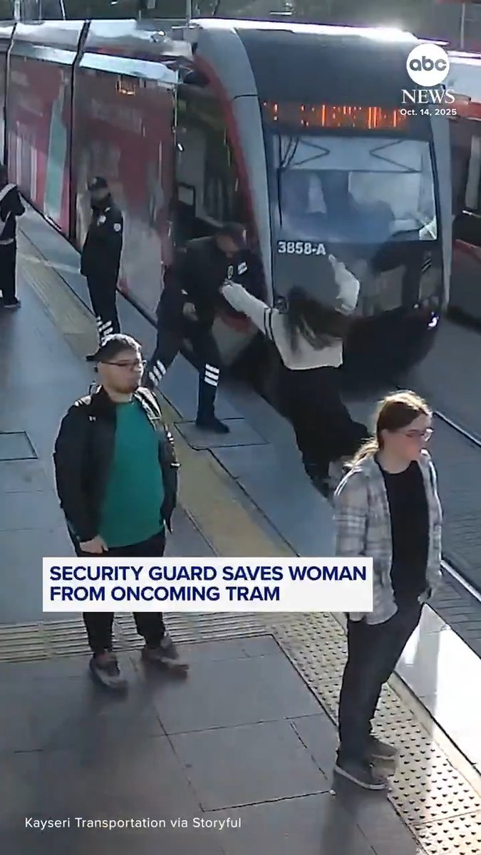 Surveillance footage captured the terrifying close call as a woman was saved by a security guard after she stepped in front of an oncoming tram in Kayseri, Turkey.