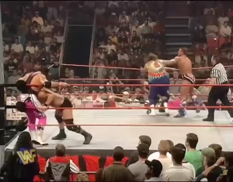 Flag Match WWF Champion The Undertaker, WWF Tag Team Champions Steve Austin &amp; Dude Love vs Bret Hart, WWF Intercontinental Champion Owen Hart &amp; WWF European Champion British Bulldog WWF RAW July 21, 1997