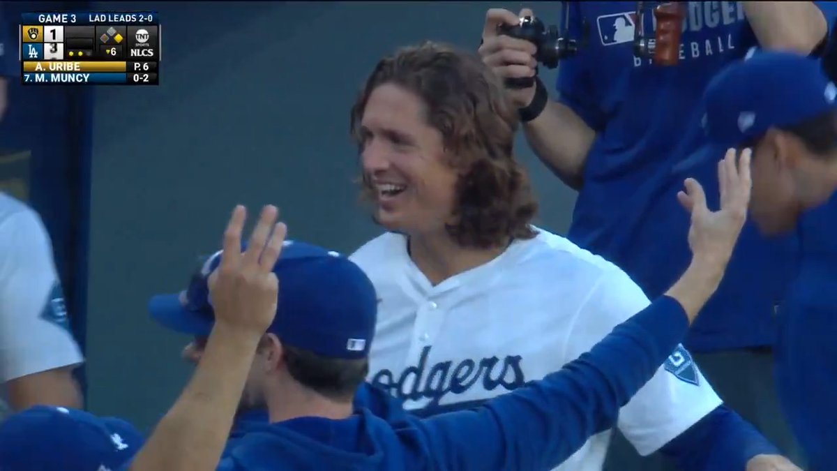 A pickoff throw gets away and the Los Angeles Dodgers extend their lead!