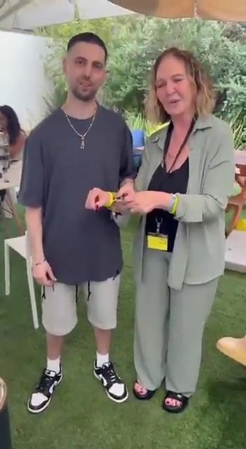 Elkana Bohbot cuts the hostage bracelet off of his mother's right hand, symbolically ending her long fight to bring him home. The bracelet on her left hand will remain until every single hostage is home.