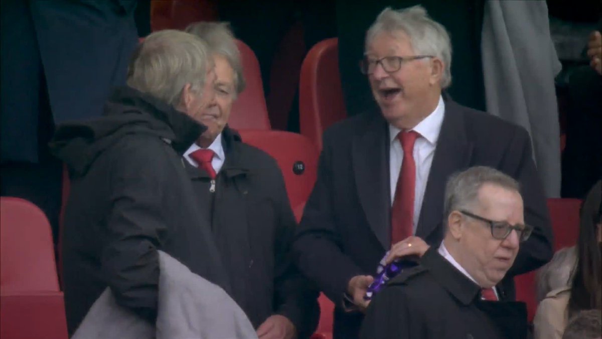 Sir Alex Ferguson and Sir Kenny Dalglish sharing chocolate buttons at Anfield 🍫