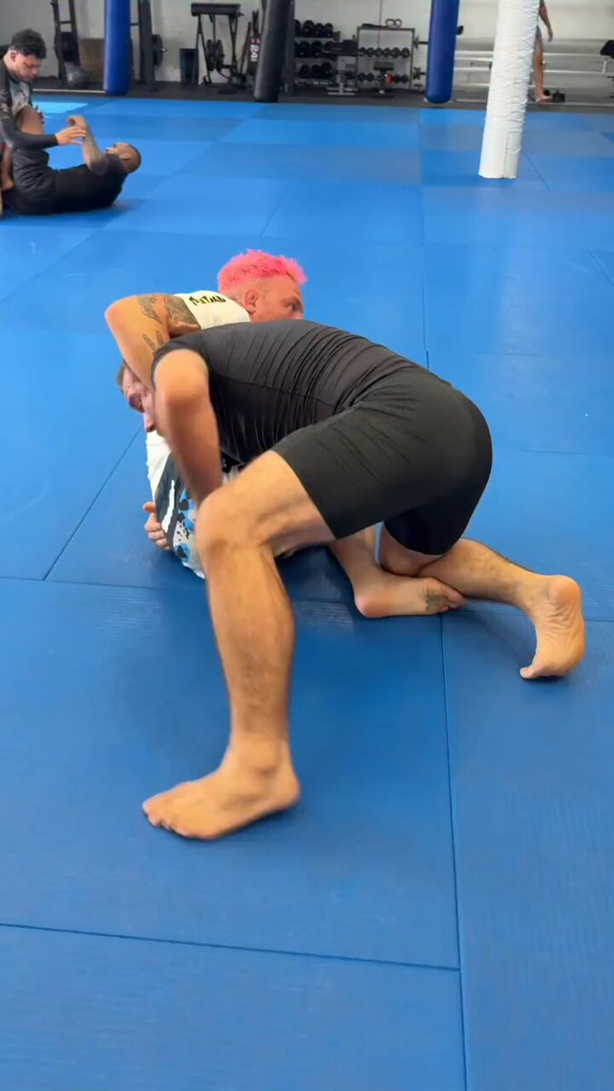 Craig Jones showing a butterfly sweep setup from a failed guillotine.