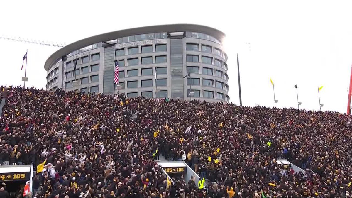 Everyone joins in a very special tradition: The Iowa Wave.