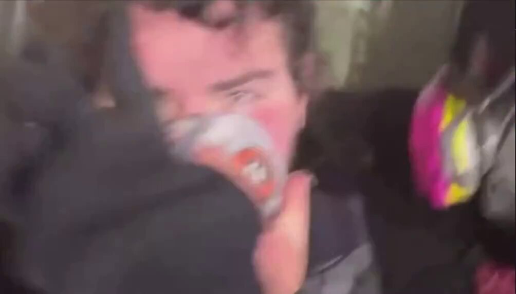 Antifa thug outside the Portland ICE facility assaulted journalist Cam Higby and ruined his property on Friday. During the fight, the thug got demasked. He cowered in fear as his identity was revealed. Today, the thug got arrested by Portland Police. Charge him as a terr*rist.