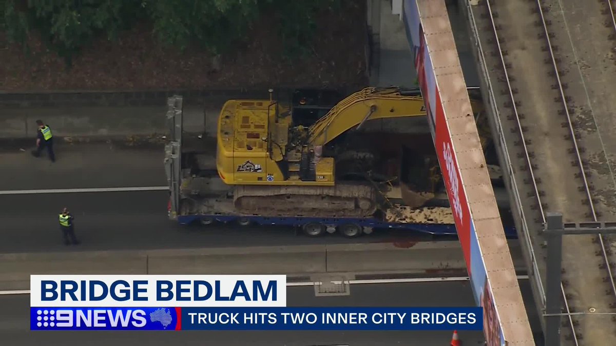 A truck driver has hit two bridges in the space of an hour, causing traffic and train delays in the inner city. #9News
