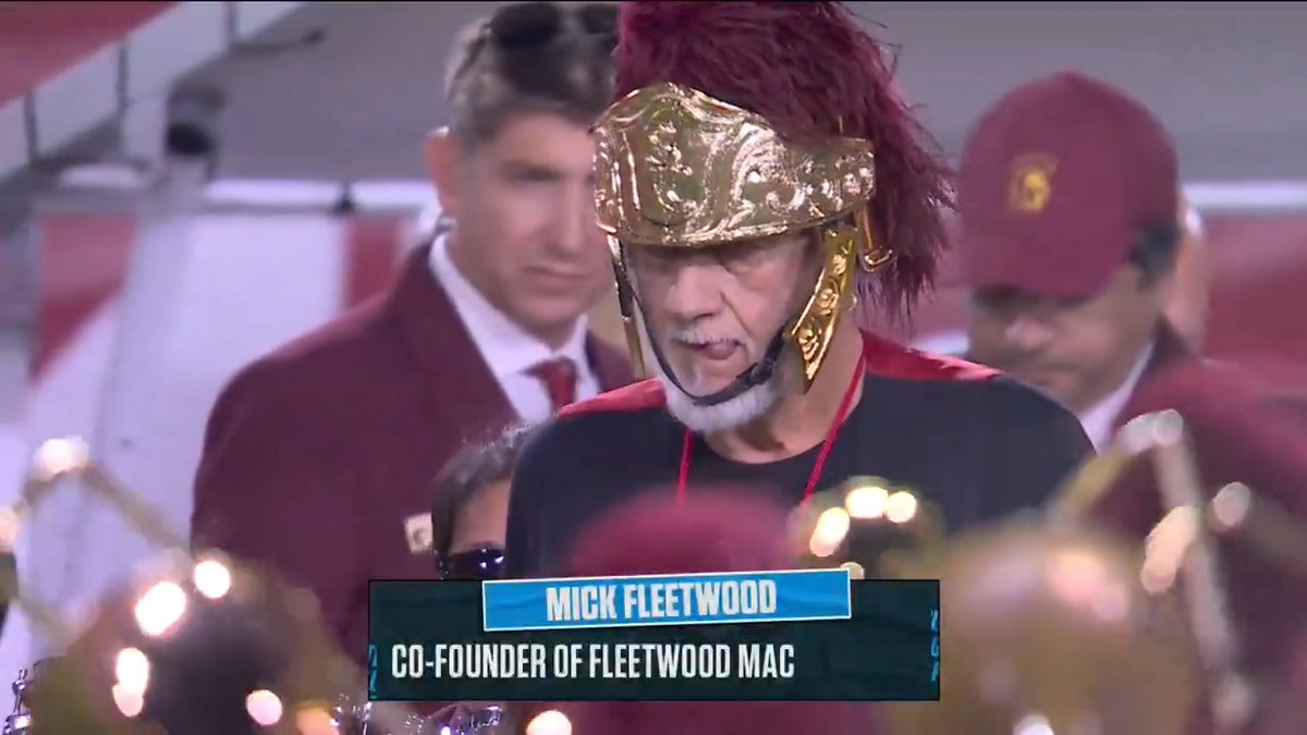 Mick Fleetwood with the USC marching band. Jason Benetti and Robert Griffin III have the Northwestern-USC call for Fox.