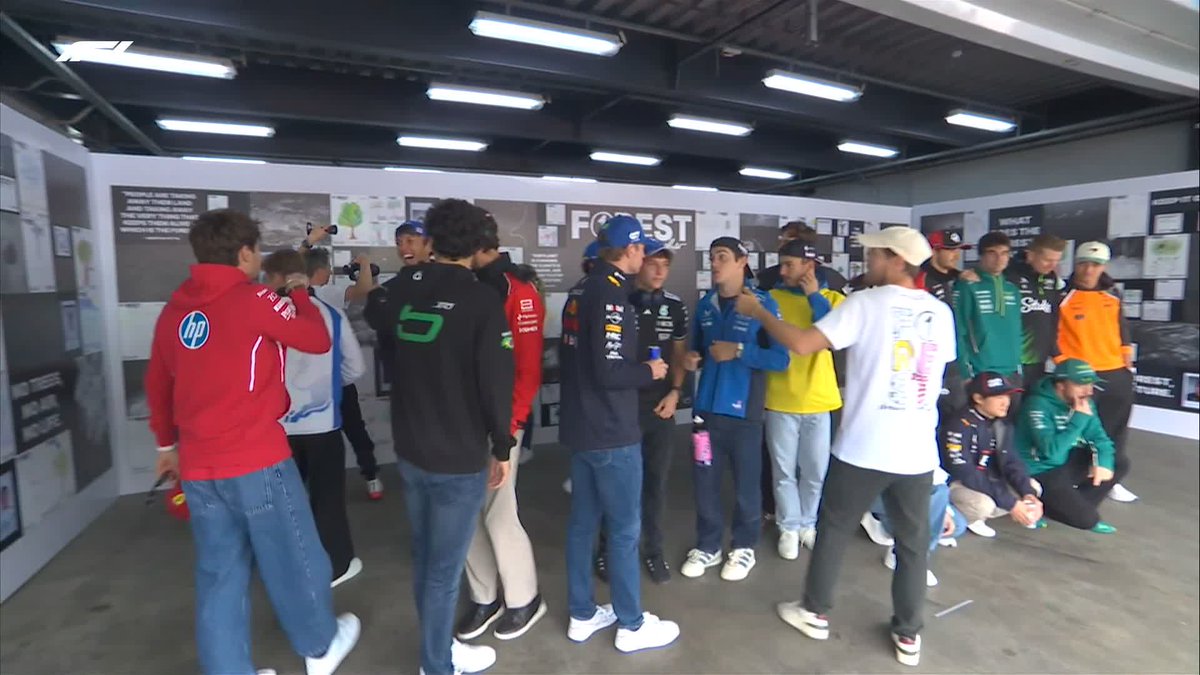 Seb sorting out the group photo 🤣 #F1 #BrazilGP
