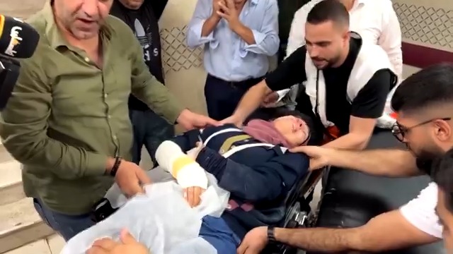 WARNING: GRAPHIC CONTENT: Over a dozen people, including a Reuters journalist, were injured when Israeli settlers attacked Palestinians, activists and reporters at an olive harvest near a West Bank outpost