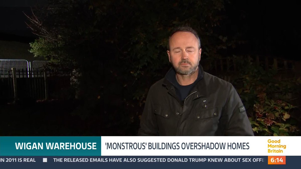 A community who have seen their homes overshadowed by the construction of four huge industrial warehouses near Wigan have served notice to the Council in an attempt to halt building. Residents say the 18-meter-high warehouses are 'monstrous'. @swainitv reports.