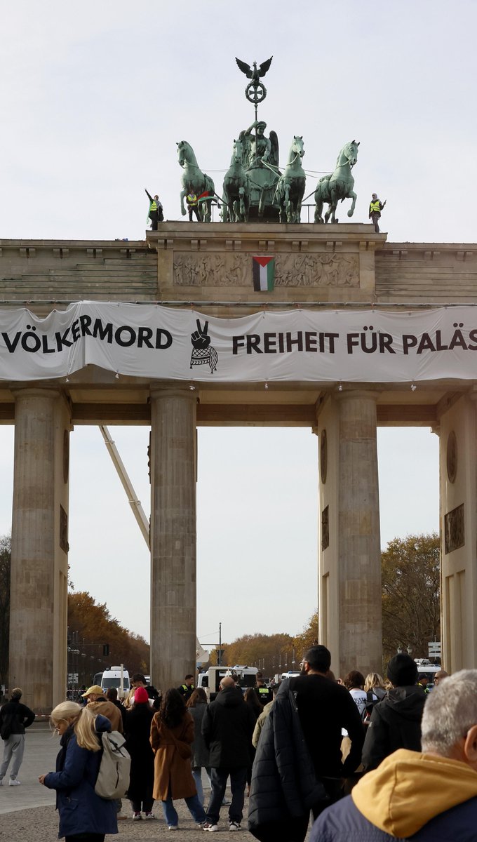 Protesters unfurled a banner reading "Never again genocide — freedom for Palestine" from Berlin's famous Brandenburg Gate. Around 75 police officers, including climbing specialists, were deployed to arrest the protesters.
