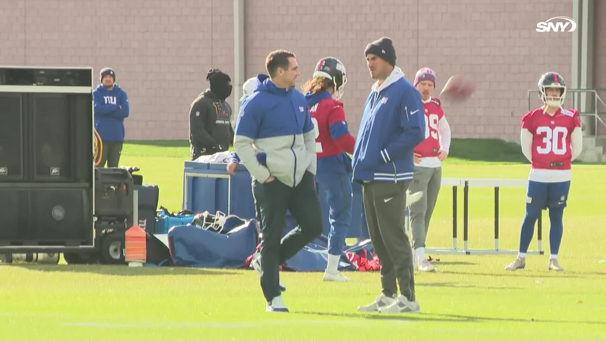 Mike Kafka and Joe Schoen chat at Giants practice