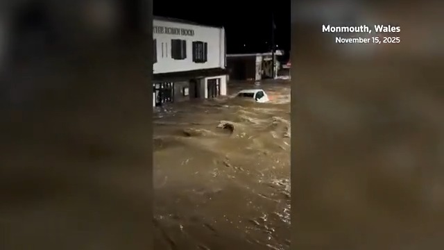 Rain and flooding hit Monmouth, Wales, with Storm Claudia causing the Monnow river to overflow, inundating shops and submerging vehicles