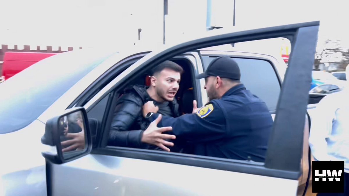 🚨Dearborn, MI is truly built DIFFERENT A Muslim man pulled-up on the group of Anti-Islam protestors, agitated and angry. The police physically had to hold him back and ordered him to leave the scene. He then returned and once again got out of his truck. WILD STUFF👀