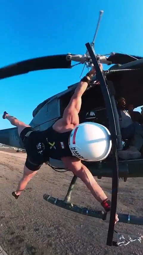 Longest duration to maintain a straddle human flag position on a flying helicopter 🚁💪 21 seconds by Samer Madi 🇱🇧 #GWRday