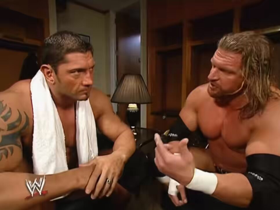 Batista picks up and looks at Triple H’s World Heavyweight Championship. This was the very tease of Batista vs Triple H