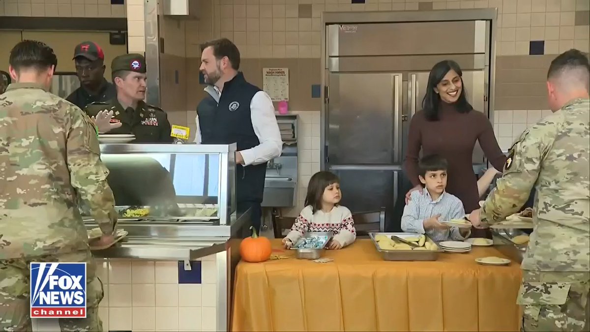 HOLIDAY HELPERS: The Vance kids showed up at Fort Campbell ready to help, serving Thanksgiving meals to U.S. troops alongside their parents. Mirabel Vance took up the honorable duty of ensuring the soldiers had butter.