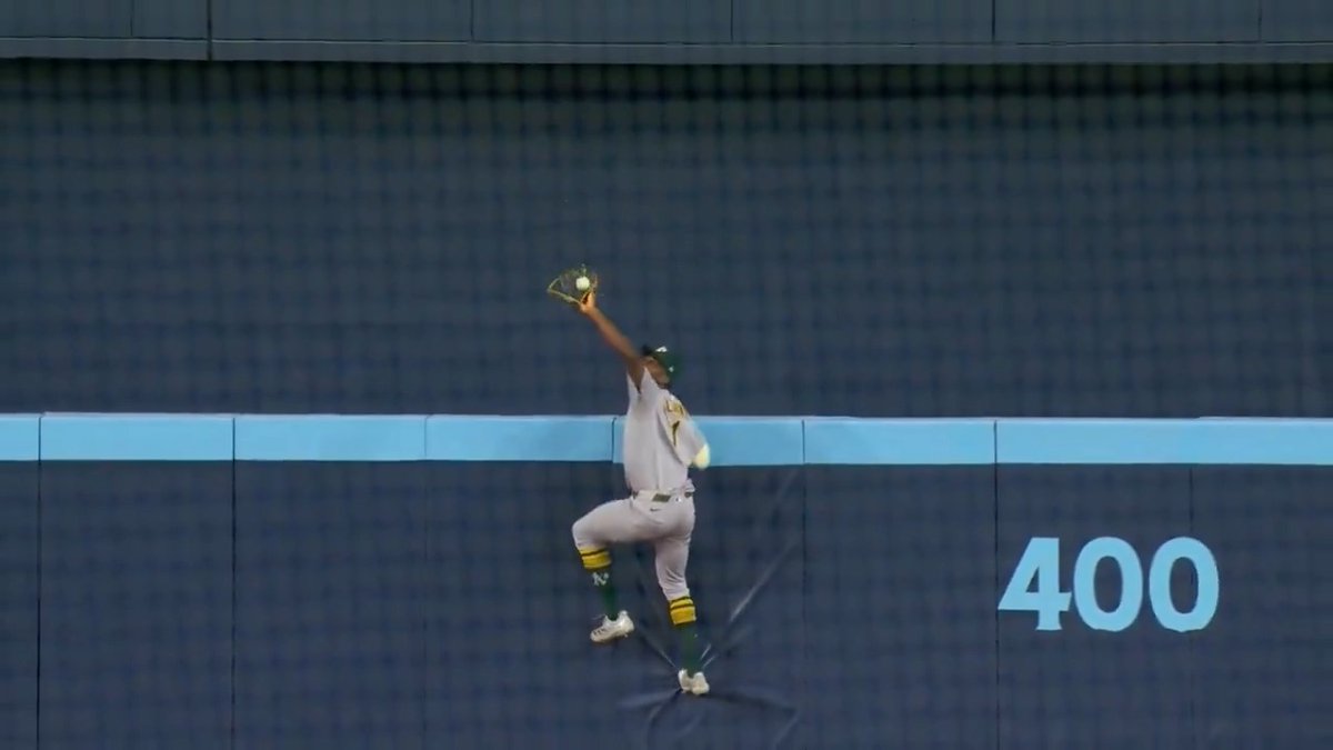 Top Plays of 2025: No. 41 Denzel Clarke scales the center field wall to rob a homer in his hometown of Toronto!