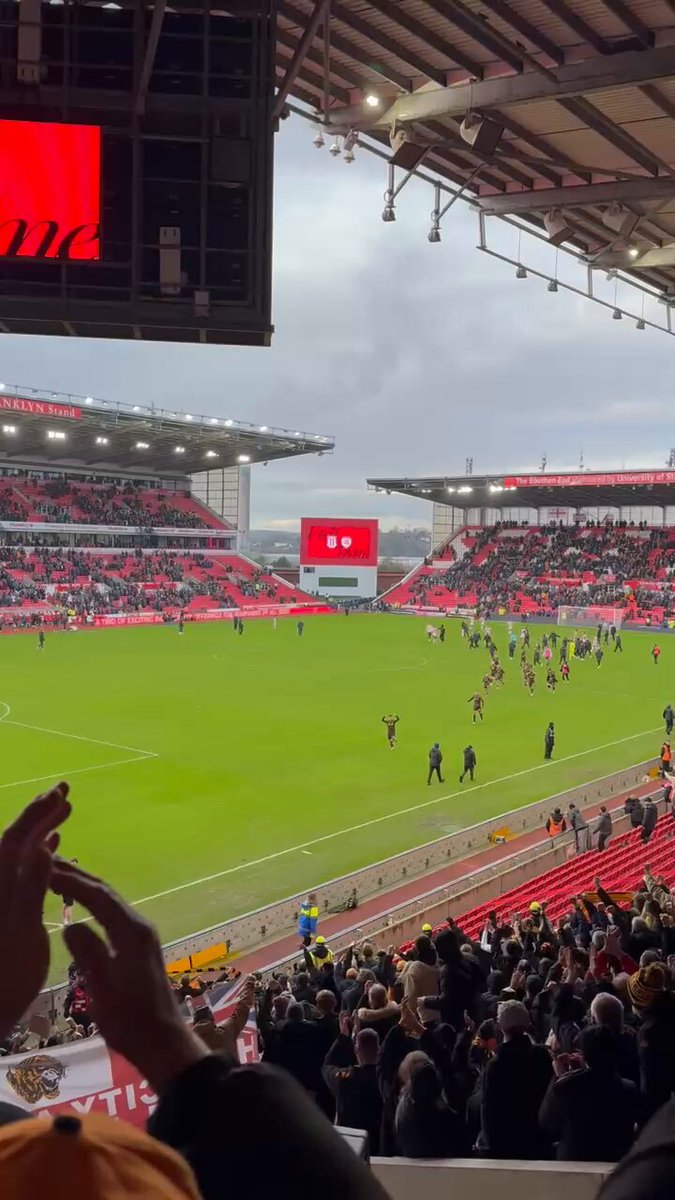 Hull fans celebrating after their win away at Stoke today. Huge win for them! 👏 #HCAFC