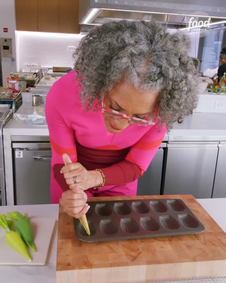 .Carla Hall gives her madeleines a merry little makeover with red and green melted candies ✨ Get the recipe: Don't miss Carla co-hosting a brand-new episode of #BeatBobbyFlay: Holiday Throwdown, Tuesday at 8|7c.