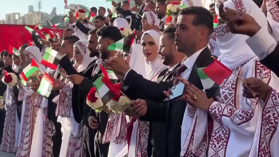 A mass wedding in Gaza's Khan Younis drew hundreds of Palestinians, with multiple couples participating in the event