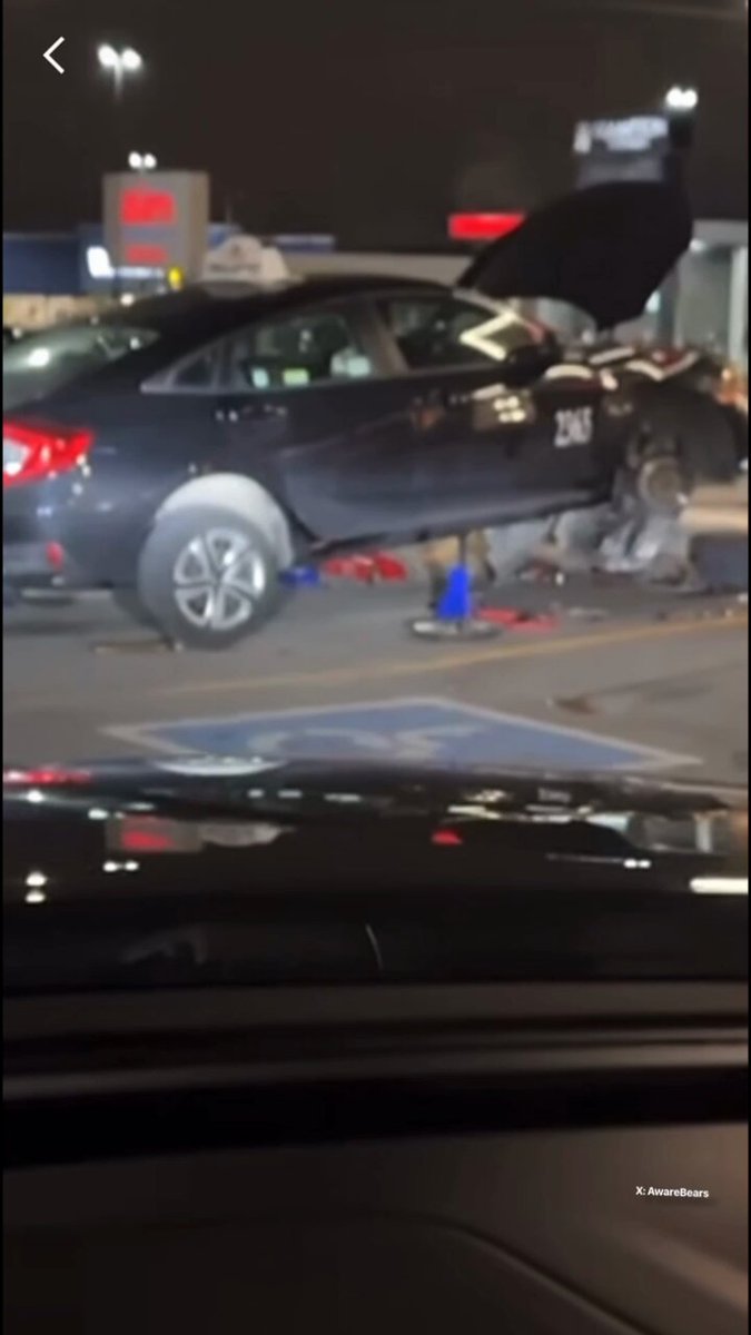 Punjabi cab driver performs an oil change and brake job in a Brampton Tim Hortons parking lot.