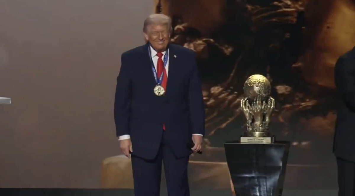 President Trump is awarded the first “FIFA Peace Prize — Football Unites the World” by his friend Gianni Infantino at the World Cup draw. Critics have speculated Trump got the award as consolation for not winning the Nobel Peace Prize.