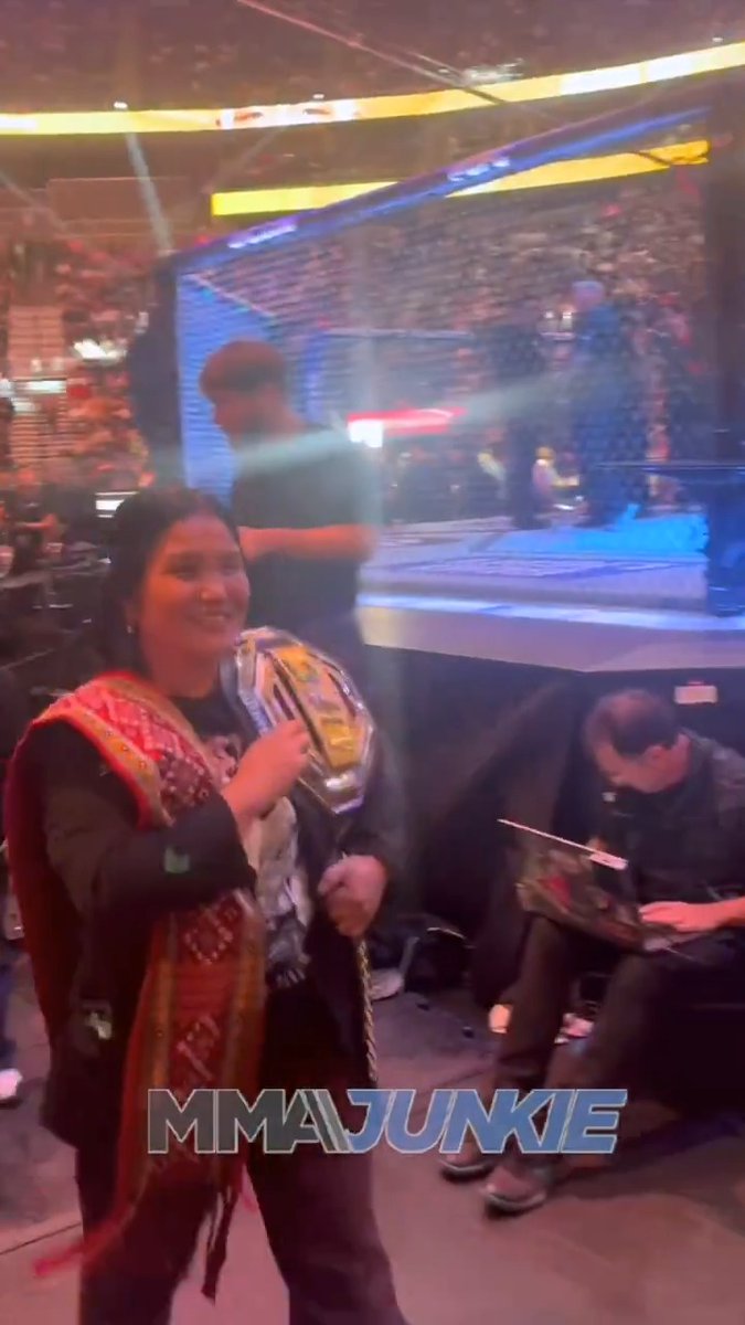 Joshua Van gave his newly won flyweight title to his mom, who proudly carried it backstage at #UFC323