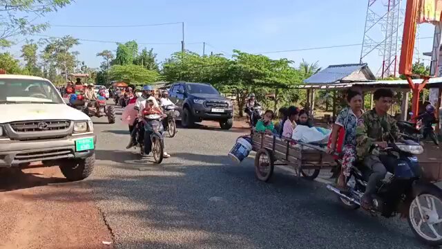 Cambodian civilians flee as fighting flares on the Thai-Cambodia border.