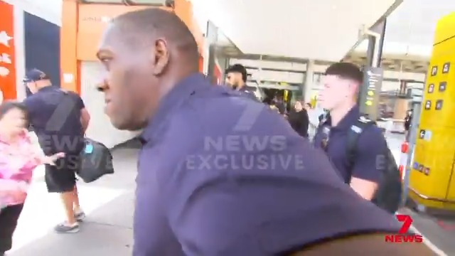 A security guard working for the English cricket team has clashed with a 7NEWS cameraman in a bizarre airport showdown. The standoff lighting the fuse for a fiery third test beginning on Wednesday. Tom Wilson