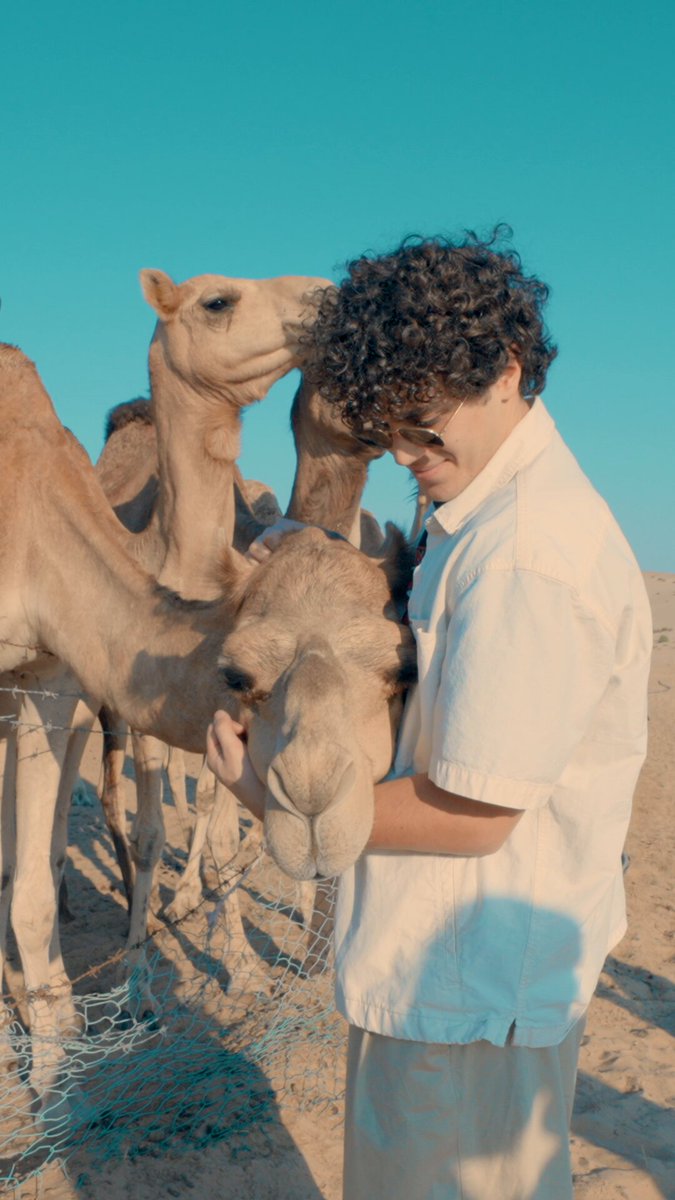 David Lanco exploring Abu Dhabi's desert on camelback 🐪