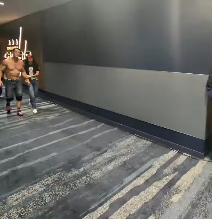 John Cena backstage with his wife, Shay after his match ended last night ❤️ (ESK)