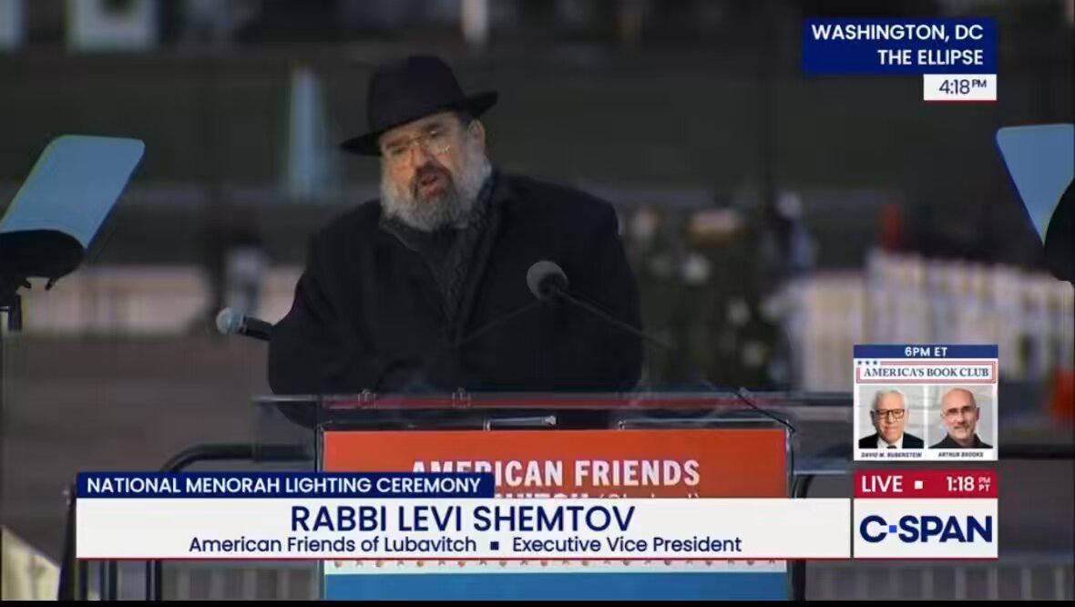Moment of silence at the start of the annual lighting ceremony of the National Menorah on The Ellipse outside the White House by Rabbi Levi Shemtov. “The darkness that came over .. across the greater Jewish community.. will be answered with strength, light .. and with resilience.”