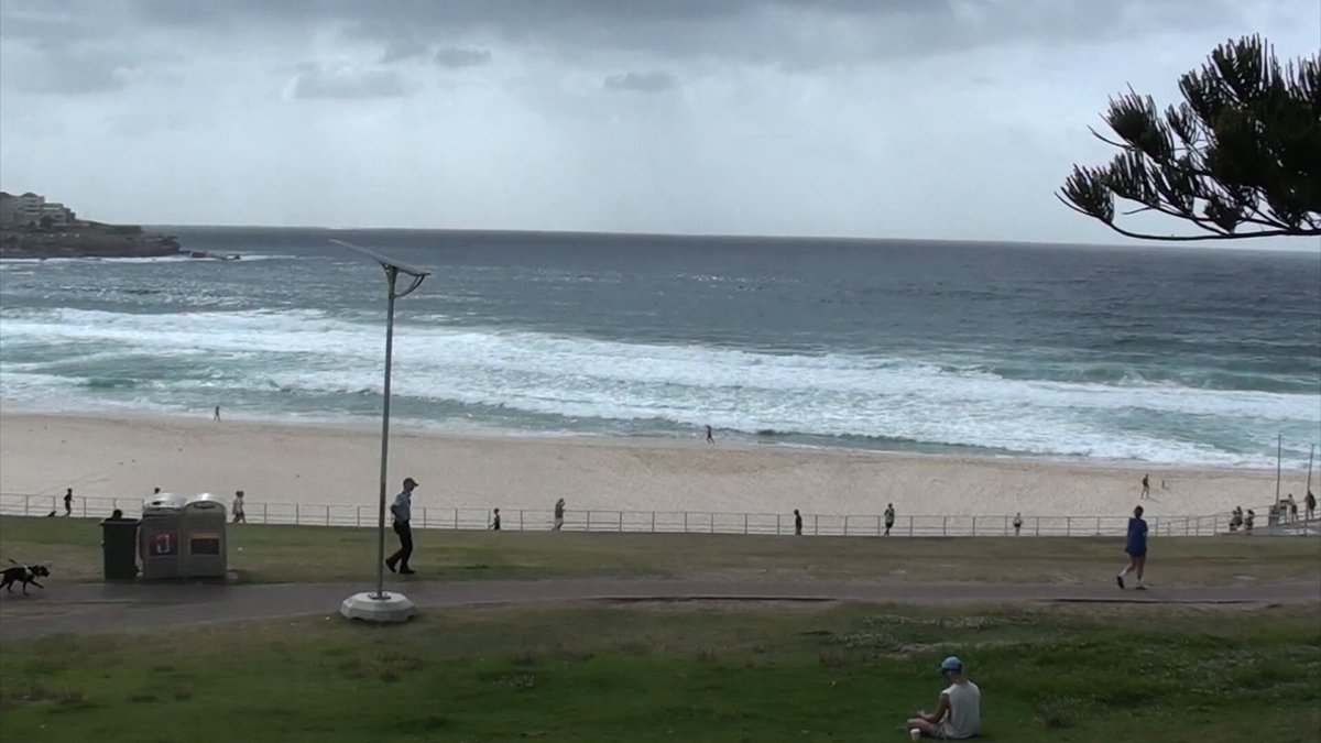 A somber morning at Bondi Beach, the day after the terrorist attack. Many in the community are showing up at Bondi Pavilion to leave flowers and take in what has happened.