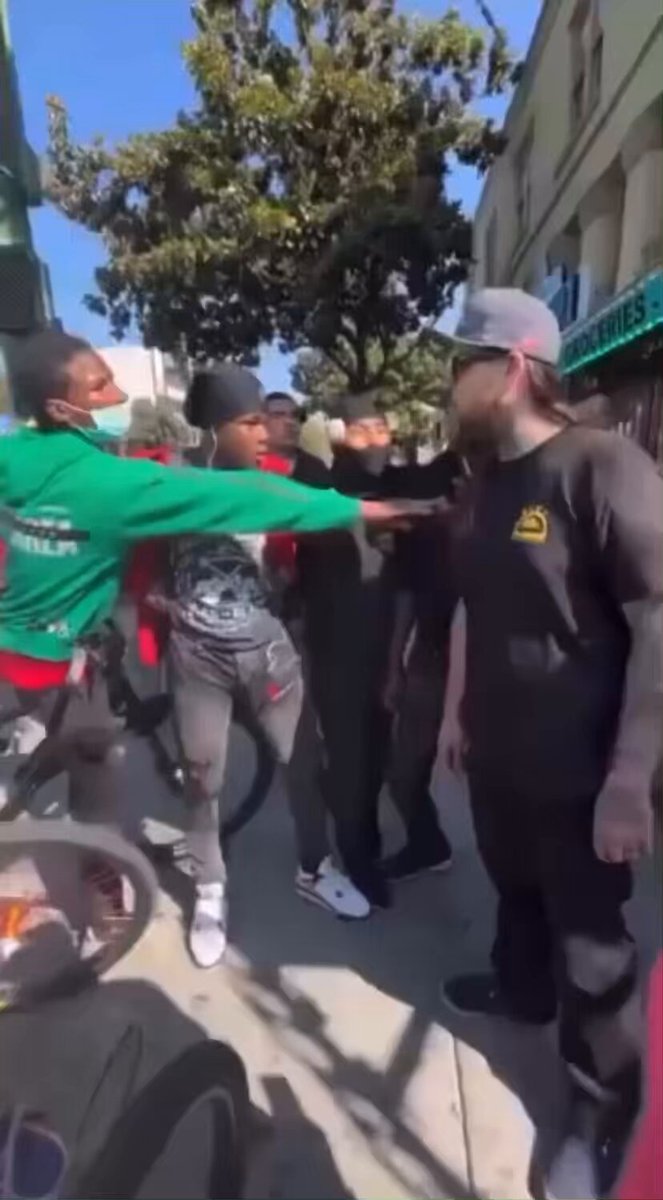 Liquor store employee gets jumped then pulls out a weapon and clears the crowd