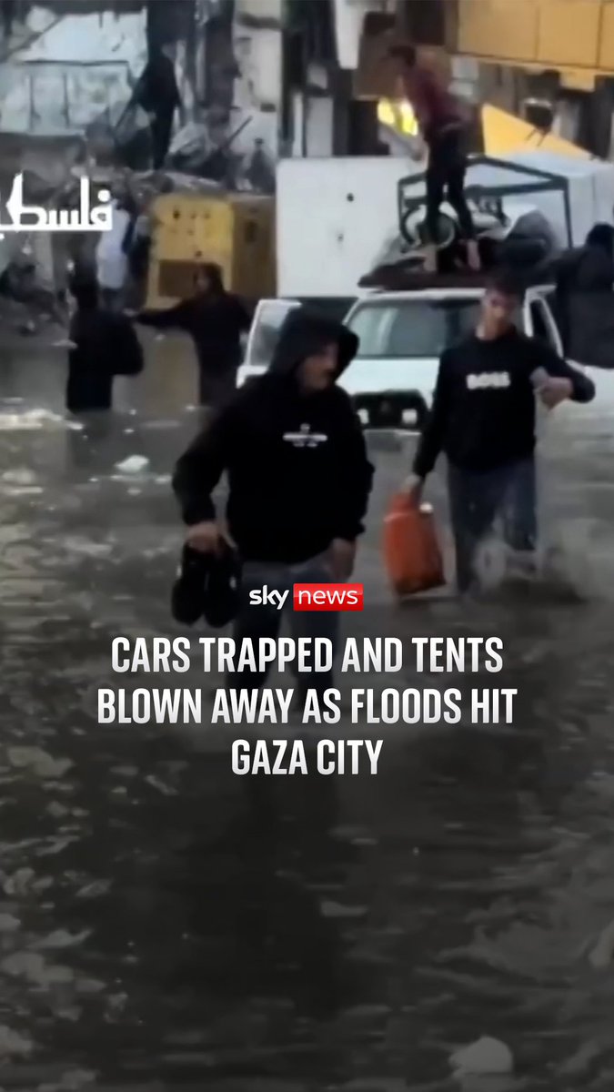 Displaced Palestinians were heavily rained on as they faced severe weather in Gaza. People wade through flood waters in Gaza City.
