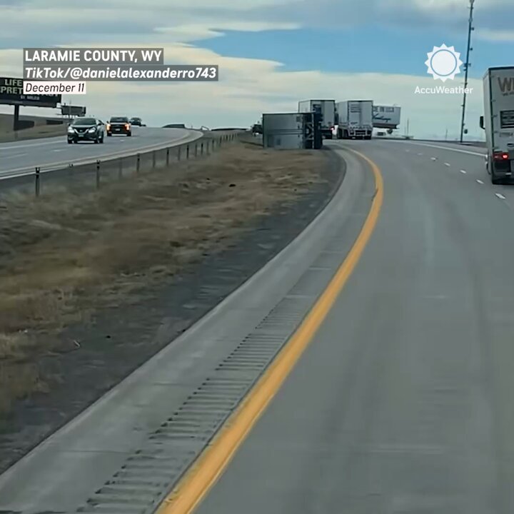 Caught on camera: Watch as a semi flips over from strong winds along I-25 in Wyoming.