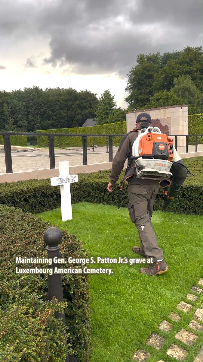 In accordance with his wishes, four-star Gen. George S. Patton Jr. was buried with his men at Luxembourg American Cemetery. His grave site is carefully maintained by ABMC staff who carries the same maintenance routine every Friday morning. They pay attention to details and ensure the horticultural elements and pavement surrounding his headstone are always in perfect conditions in honor of his service.