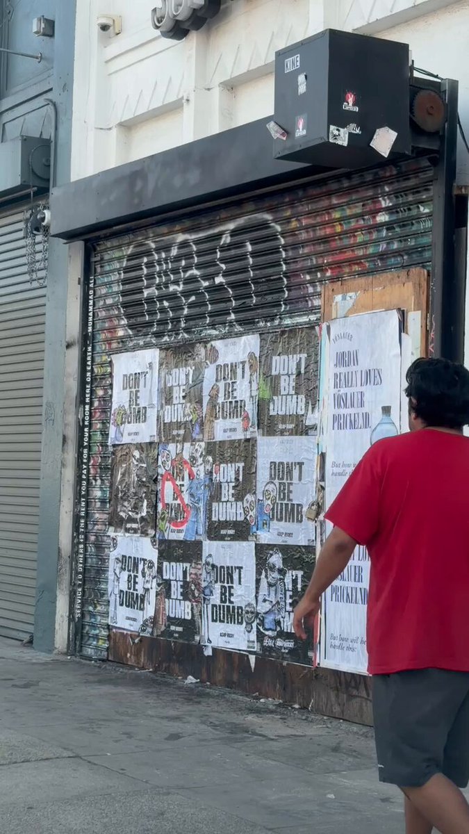 Fans were spotted peeling A$AP Rocky’s “DON’T BE DUMB” posters off walls and walking away with them