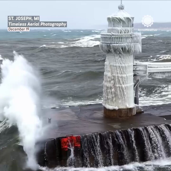 Drone video captured massive waves slamming a completely frozen lighthouse on Lake Michigan