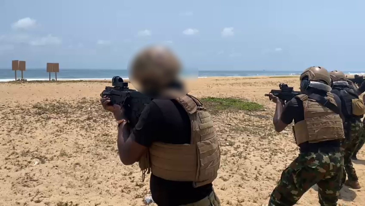 Nigerian Navy Special Boat Service operatives conducting marksmanship drills on a beach range with their standard issue Tavor bullpup rifle.