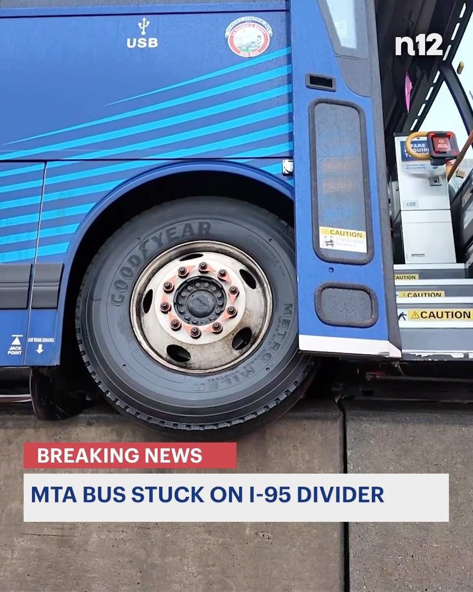 BREAKING NEWS: An MTA bus is seemingly stuck on the divider in the middle of I-95, tilted onto its side. - #News12BX #Transit