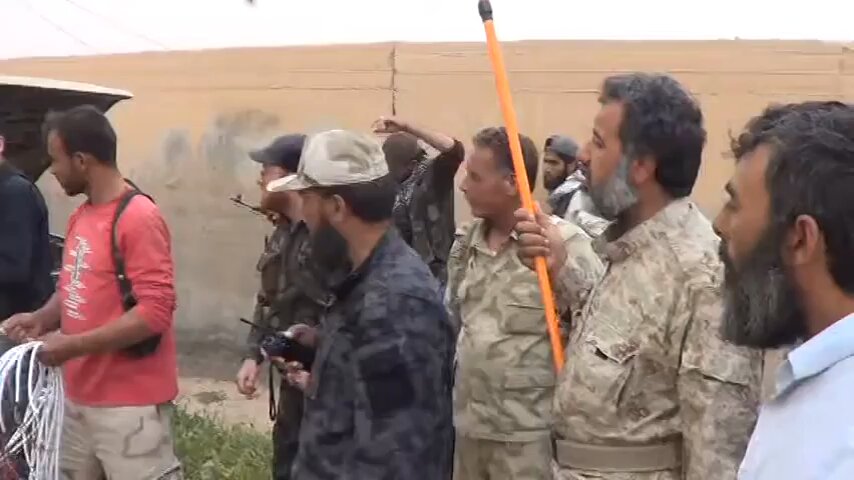 Jafar al-Tayyar brigade use a C-10 pickup battery to launch rockets towards SAA positions near Deir ez-Zor airport, Deir ez-Zor Governorate, 2013